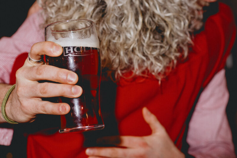 A man and woman hugging in a bar.