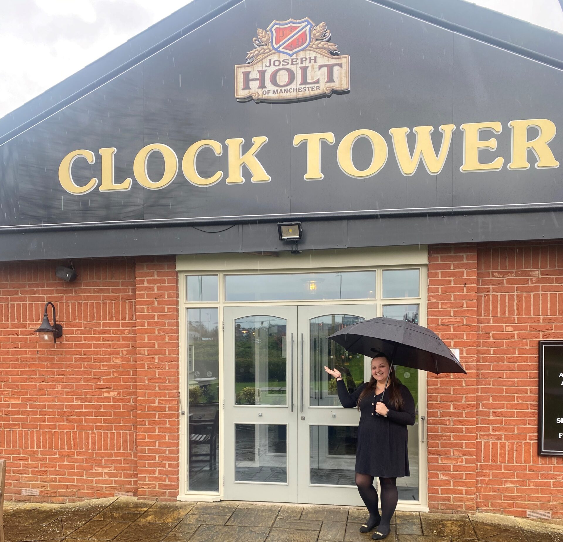 Our youngest landlady stood outside the Clock Tower pub